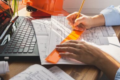 architect design working drawing sketch plans blueprints and making architectural construction model