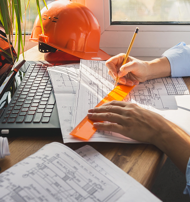 architect design working drawing sketch plans blueprints and making architectural construction model