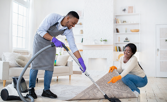positive black couple cleaning up together vacuum 2023 11 27 05 20 27 utc